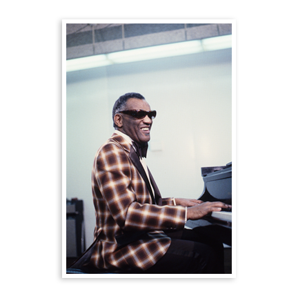 Ray Charles playing the piano in the recording studio