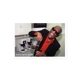 Ray Charles laughing and pouring a cup of coffee